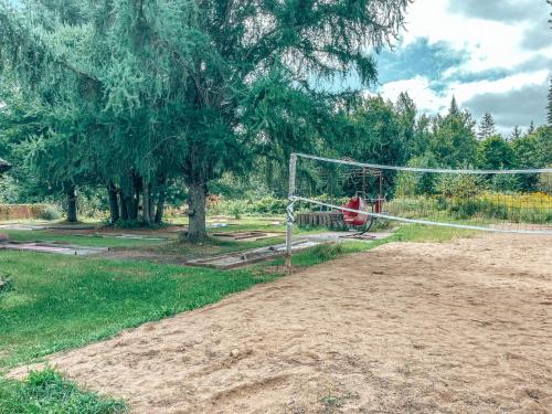 a person sitting in front of a soccer net at Gîte B&B du Village in Saint Mathieu Du Parc