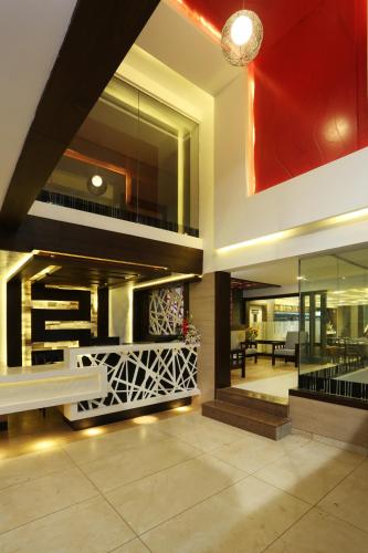 a lobby of a house with a large window at moriz inn in Mysore