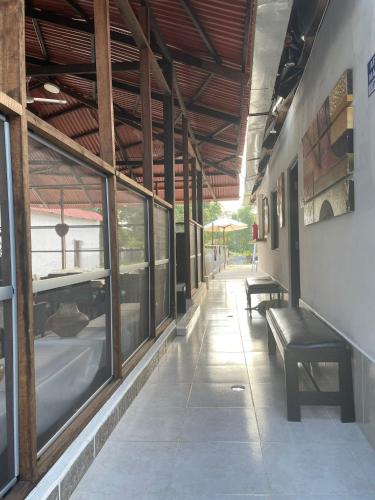a hallway with benches and windows in a building at Amazon Lodge Varillal in Iquitos