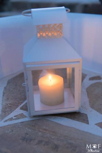 a candle sitting inside of a small box at Hotel Elena in Alinda