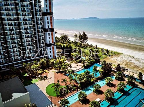 a view of the beach from the balcony of a building at DAZA RESIDENCE @ TIMURBAY SEAFRONT KUANTAN in Kuantan