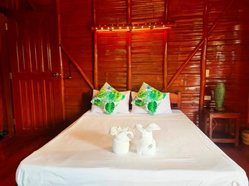 Katil atau katil-katil dalam bilik di Winyanz Tambayan Tourist Inn