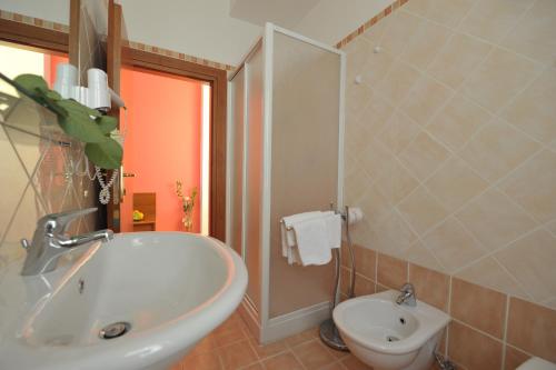 a bathroom with a sink and a toilet at Hotel Astor in Perugia