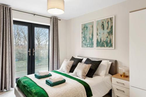 a bedroom with a bed and a large window at Boutique Beautiful Leeds Gem - Sleeps 2 in Leeds