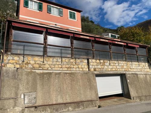 a building with two garage doors on a wall at Casa Laura in Zoagli