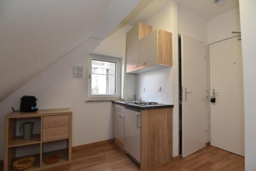 a small kitchen with a sink and a window at PM CityAPART Lend in Graz