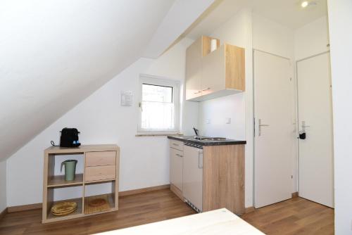 a small kitchen with a sink and a stove at PM CityAPART Lend in Graz