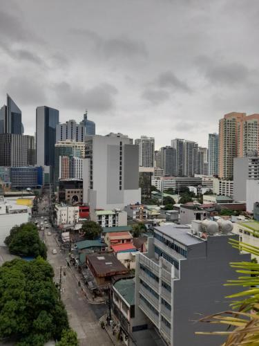 a cityscape of a city with tall buildings at VICTORIA DE MAKATI Two (2) Bedroom Up and Down Condo in Manila