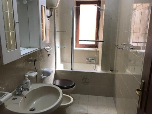 a bathroom with a sink and a toilet and a shower at Casa Degli Oleandri in Paola