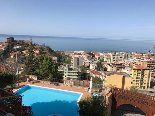 a swimming pool with a view of a city at Casa Degli Oleandri in Paola
