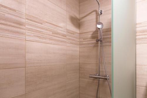 a bathroom with a shower with a glass door at Gostišče Marin Miler in Prevalje