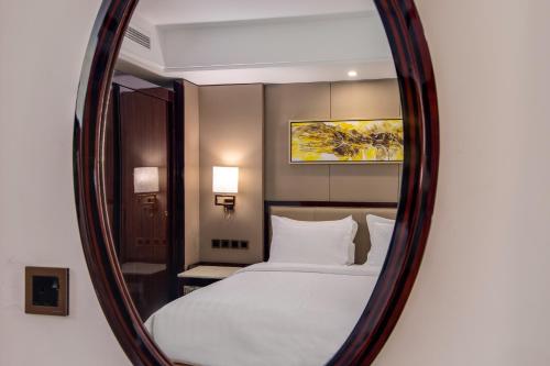 Al Ertiqaa Hotelにあるベッド