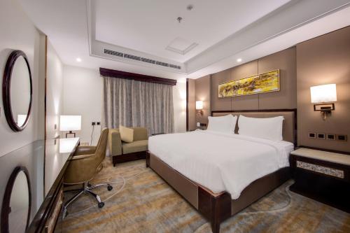 Al Ertiqaa Hotelにあるベッド