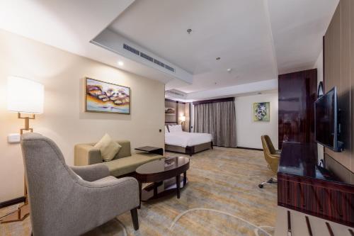 Al Ertiqaa Hotelにあるテレビまたはエンターテインメントセンター