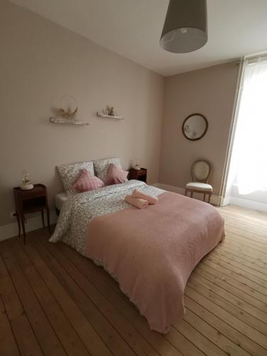 Postel nebo postele na pokoji v ubytování Gîte des Frangines