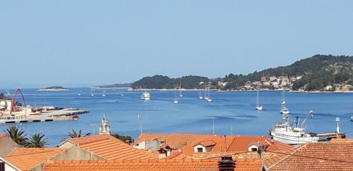 a view of a harbor with boats in the water at Sunset Vela Luka in Vela Luka