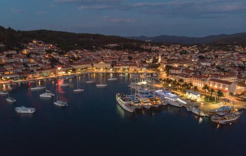 a group of boats docked in a harbor at night at Sunset Vela Luka in Vela Luka