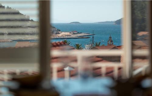 a view of the ocean from a window at Sunset Vela Luka in Vela Luka