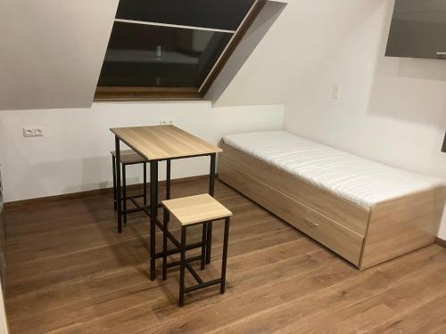 Кровать или кровати в номере Mastros Ferienwohnung Huchenfeld