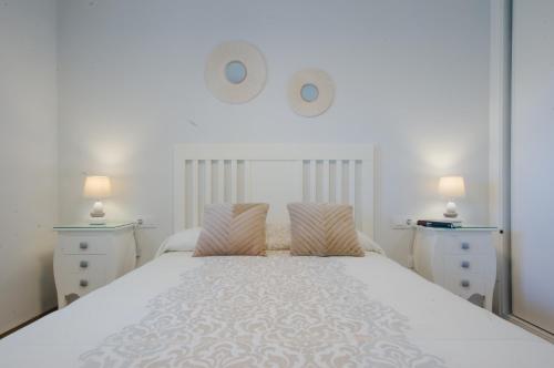 Ένα ή περισσότερα κρεβάτια σε δωμάτιο στο Laja Bermeja, piscina y primera línea de La Barrosa