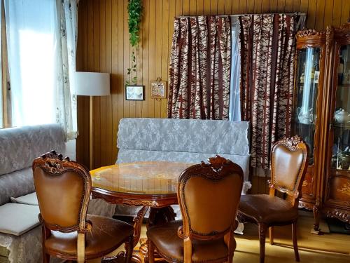 a dining room with a table and chairs at Grandmother's Vegetable garden in Anseong