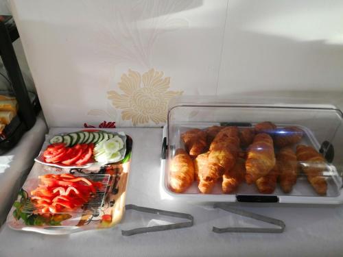 a refrigerator with two trays of food in it at La Luna Blanca in Torremolinos