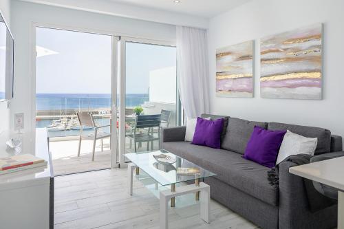 a living room with a couch and a table at Casa Mercedes, Puerto del Carmen in Puerto del Carmen