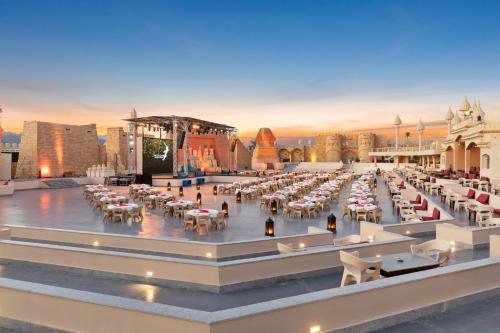 a rendering of a large outdoor amphitheatre with tables and chairs at Pickalbatros Aqua Park Sharm El Sheikh in Sharm El Sheikh