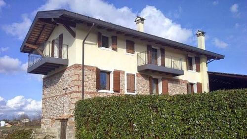 a house with two balconies on top of it at CASAL MICELIO in Udine