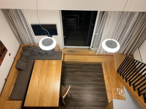 an overhead view of a living room with a dining table at Palava eu 8 in Pavlov