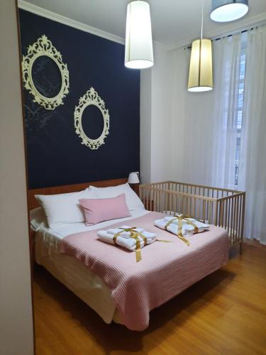 a bedroom with a bed with two towels on it at BERAMAR APARTMENT in Viveiro