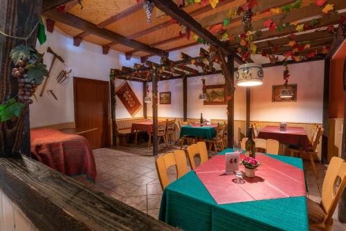 a restaurant with a table and chairs in a room at Hotel Deis in Senheim