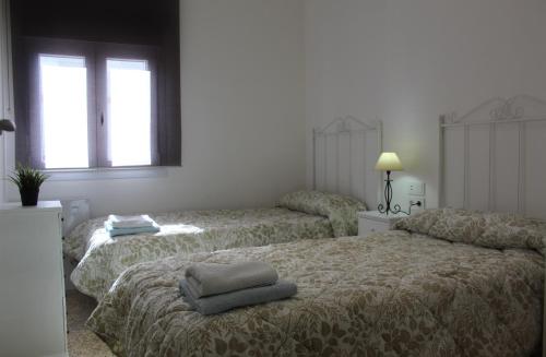 Postel nebo postele na pokoji v ubytování Apartamento Calle Huelva by CasaTuristica