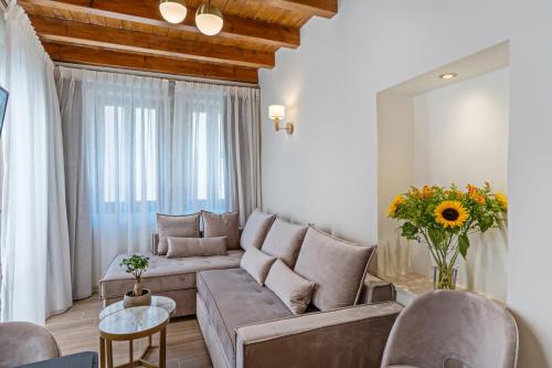 a living room with a couch and a table at Casa Del Balsamo in Rethymno Town