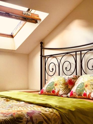 a bedroom with a bed with a black frame at Zorab&b in Breganzona