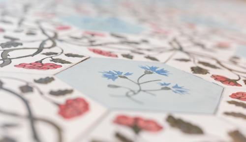 a table topped with paper with flowers on it at Boutique Hotel Gaia in Kecskemét