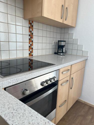 a kitchen with a stove and a counter top at Wohnung Magdalena in Feldkirchen in Kärnten