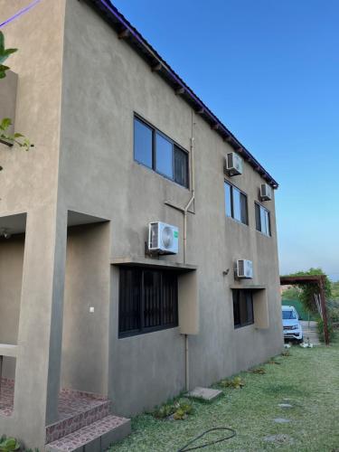 a building with a car parked outside of it at CC House in Chidenguele