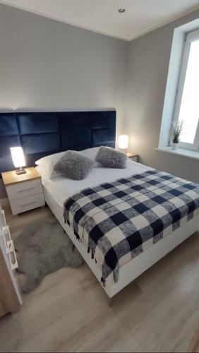 Postel nebo postele na pokoji v ubytování Apartament Nowodworska