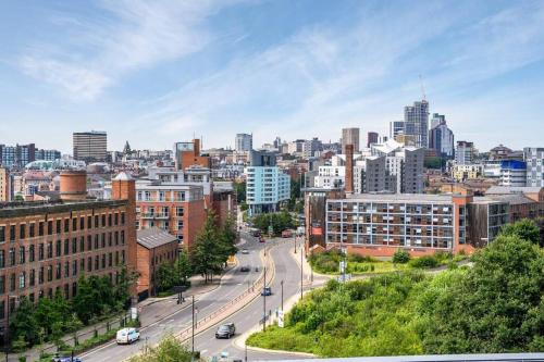 a view of a city with buildings and a street at Yorksha Luxury Apartments Leeds in Leeds