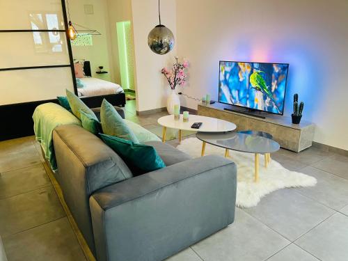 Posezení v ubytování Appartement atypique : Le Puits