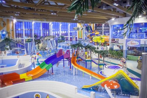 a water park with a water slide and a water slide at Time for Cracow in Krakow