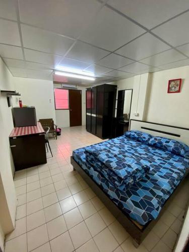 a bedroom with a bed in a room at Ratanawong Place 553 in Bangkok