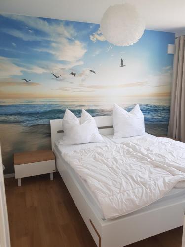 Postel nebo postele na pokoji v ubytování Ferienwohnung MeerBlick OG