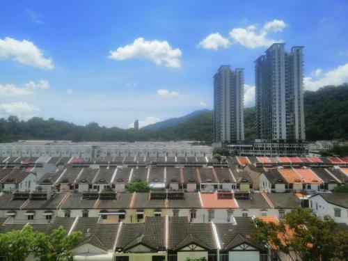 a view of a city with tall buildings and roofs at Zulcity Homestay in Gelugor