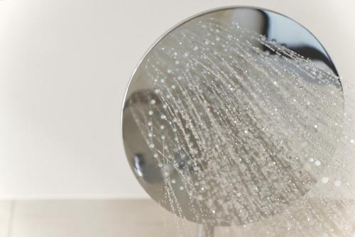 a shower head with water pouring out of it at Villa Mouria private seaview villa in Pogoniá