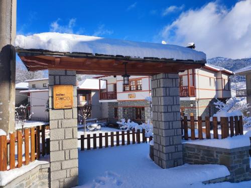 a gazebo with snow on top of it at NUCA GUESTHOUSE in Metsovo
