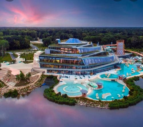 an aerial view of a resort with a pool at Disney cocooning à 5 minutes du Parc in Coupvray