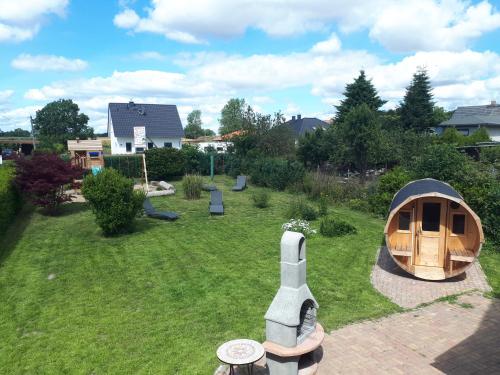 a backyard with a gazebo in the grass at Villa Strandräuber in Zudar