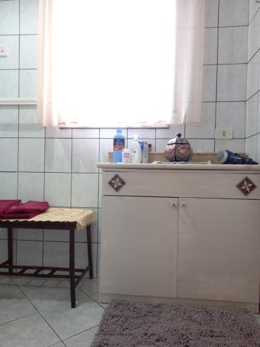 a kitchen with a sink and a table and a window at D'ALTRITEMPI-Elegance in Cianciana. in Cianciana